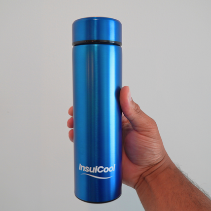 InsulCool Siberian portable insulin cooling case in blue, held in hand